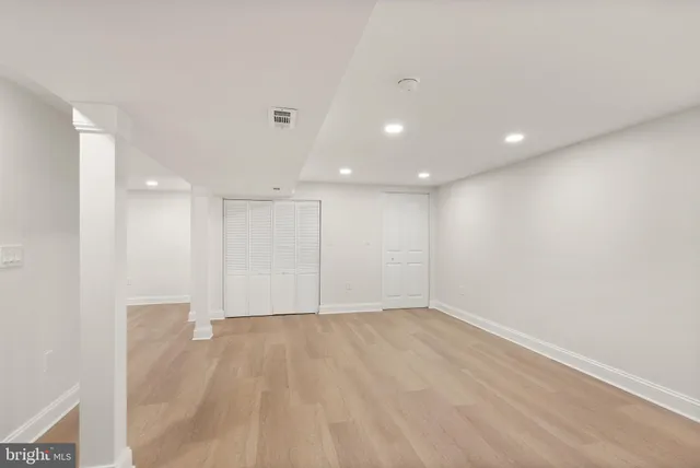 a bathroom with a sink mirror and vanity