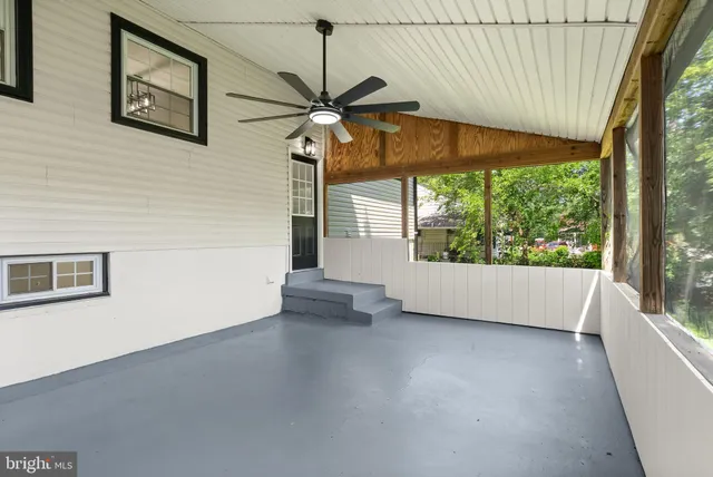 a front view of a house with a yard and porch