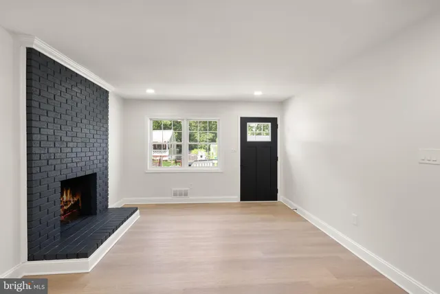a kitchen with stainless steel appliances a refrigerator sink and microwave