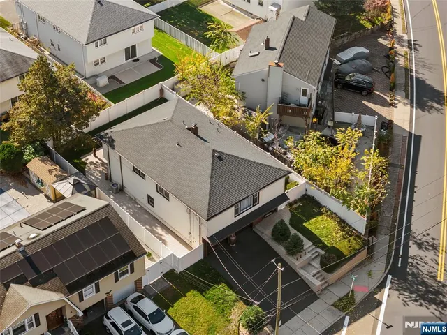 an aerial view of a house with a garden