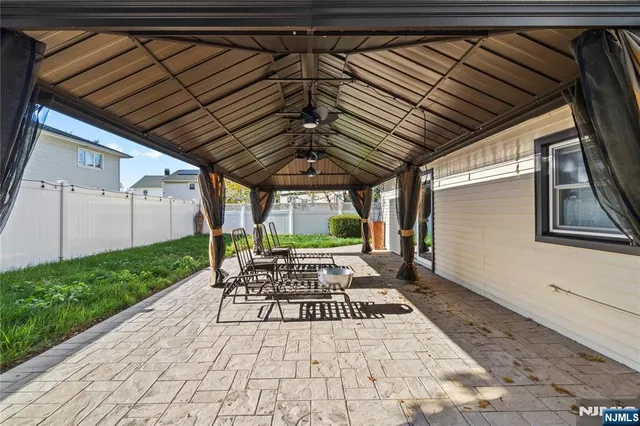 a view of yard with patio