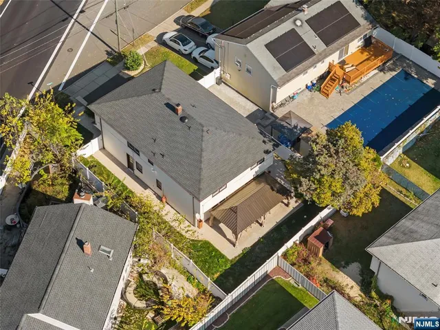 an aerial view of a house with a ocean view