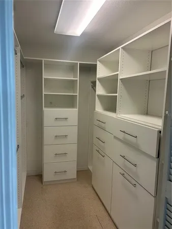 a view of an empty walk in closet