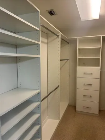 a view of an empty walk in closet