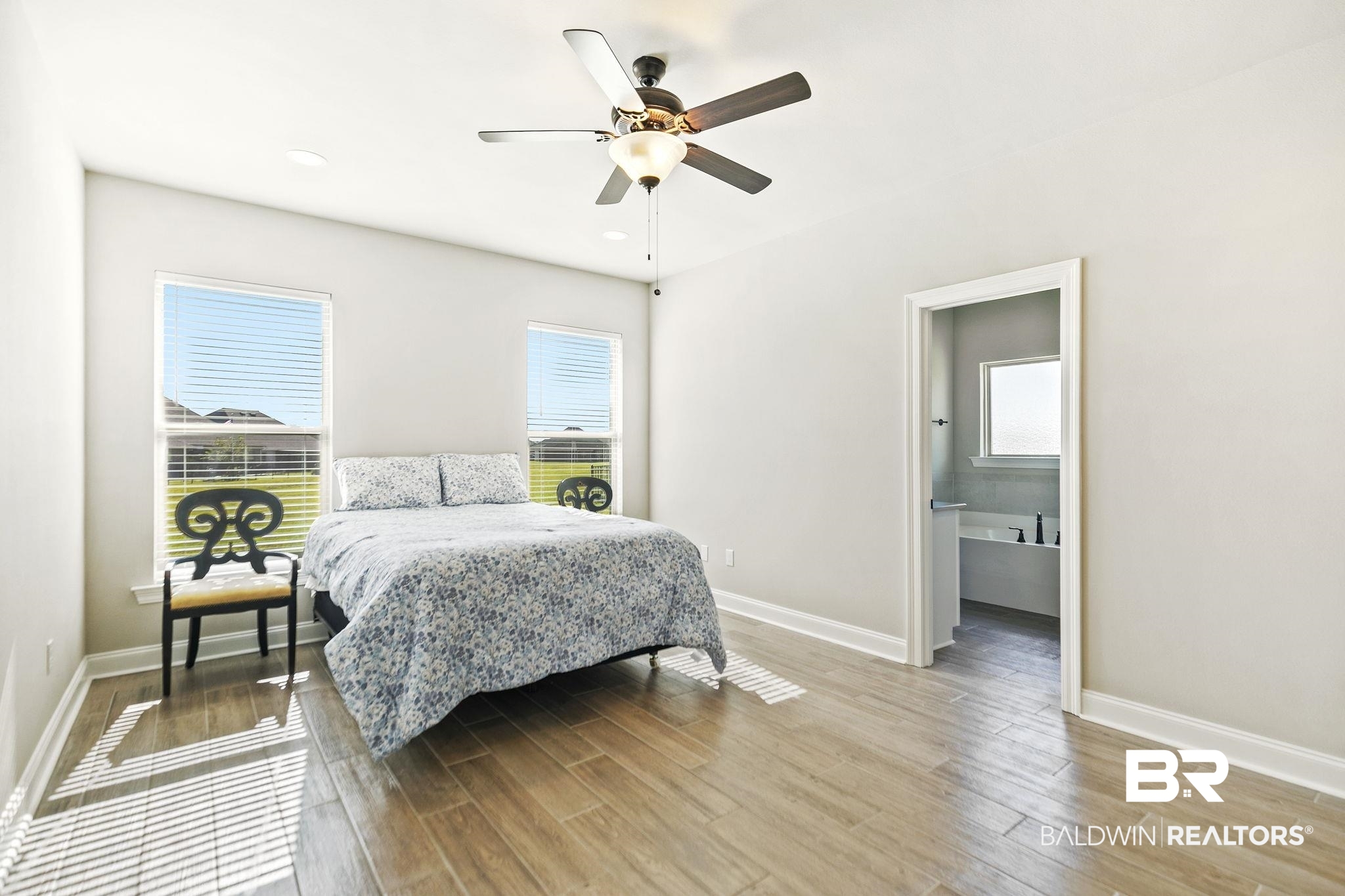 10140 Chipper Lane Foley, AL 36535 - Photo 27 of 72 Bedroom with ceiling fan, light hardwood / wood-style flooring, and multiple windows