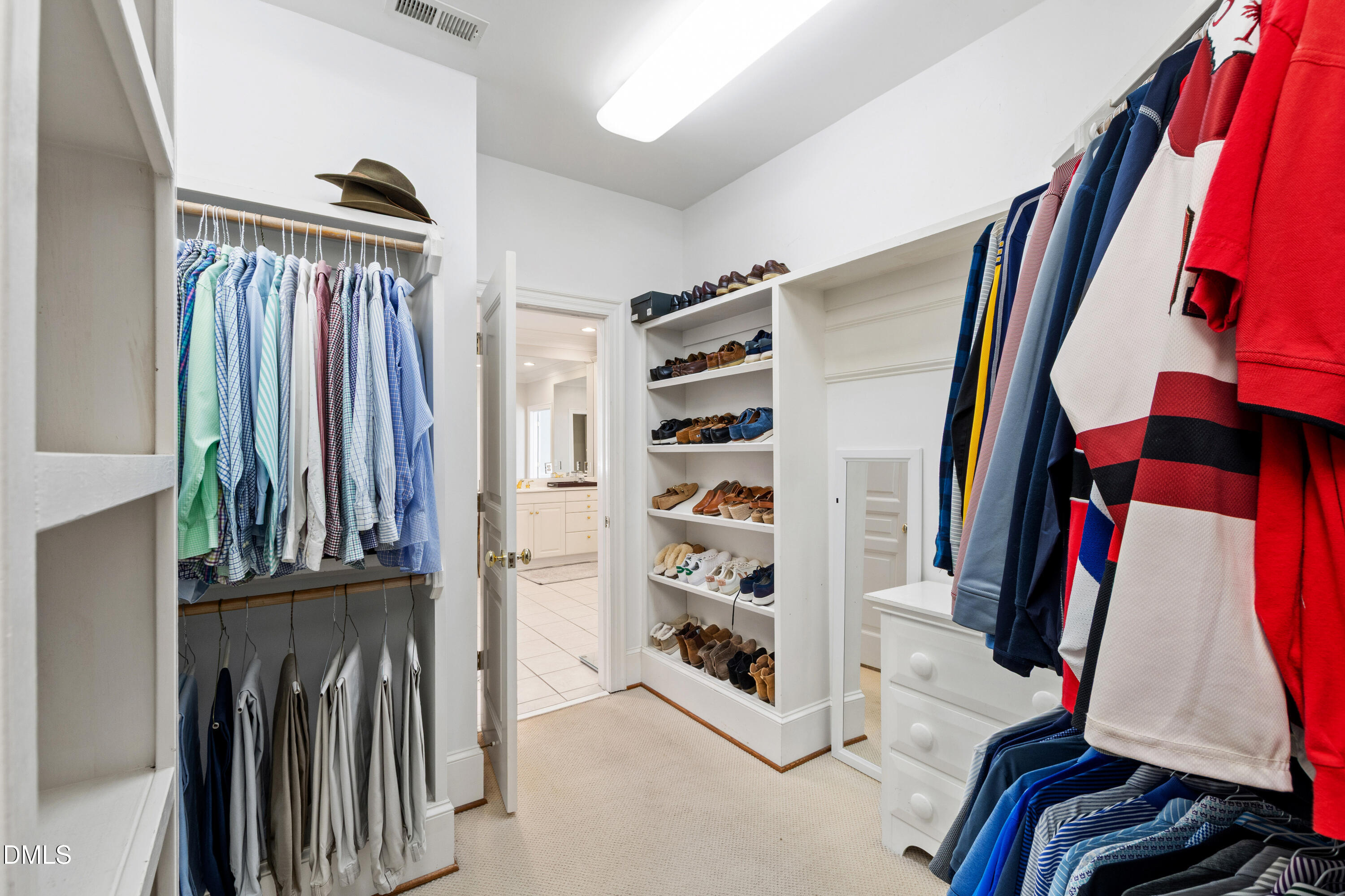 2536 Wake Drive Raleigh, NC 27608 - Photo 37 of 74 a view of walk in closet with clothes and shoes
