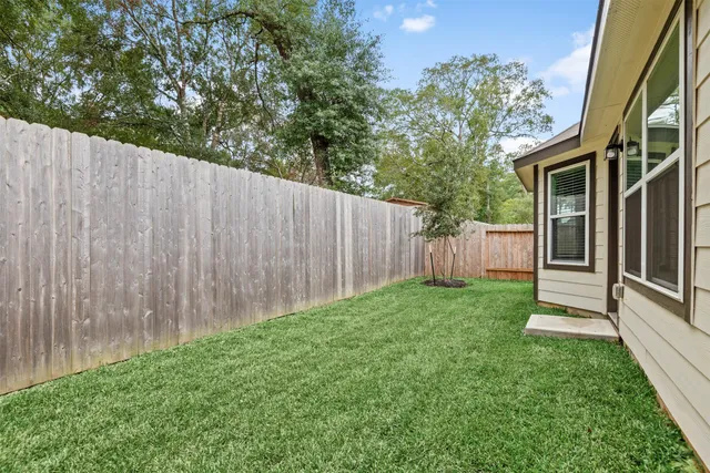 a view of backyard with green space