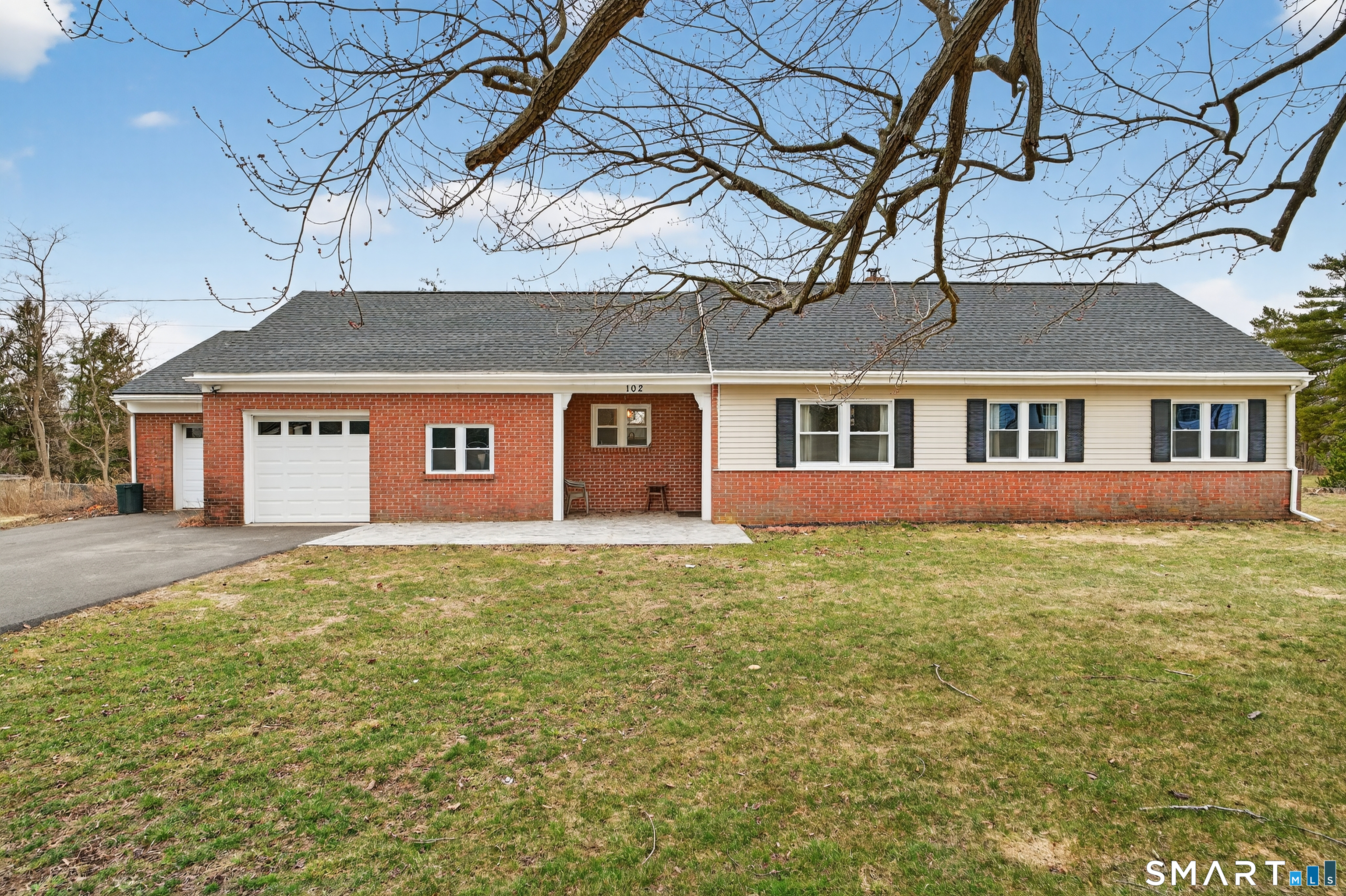 front view of a house with a yard