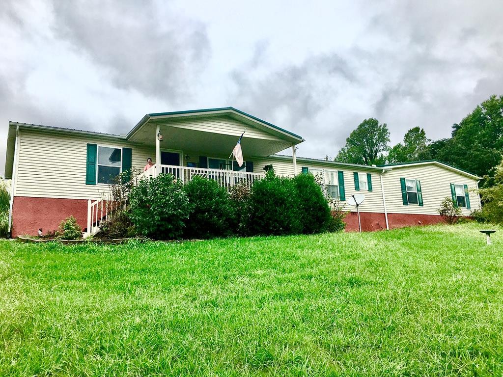 586 Old Stage Road Dandridge, TN 37725 - Photo 1 of 11 a view of a house with backyard and garden