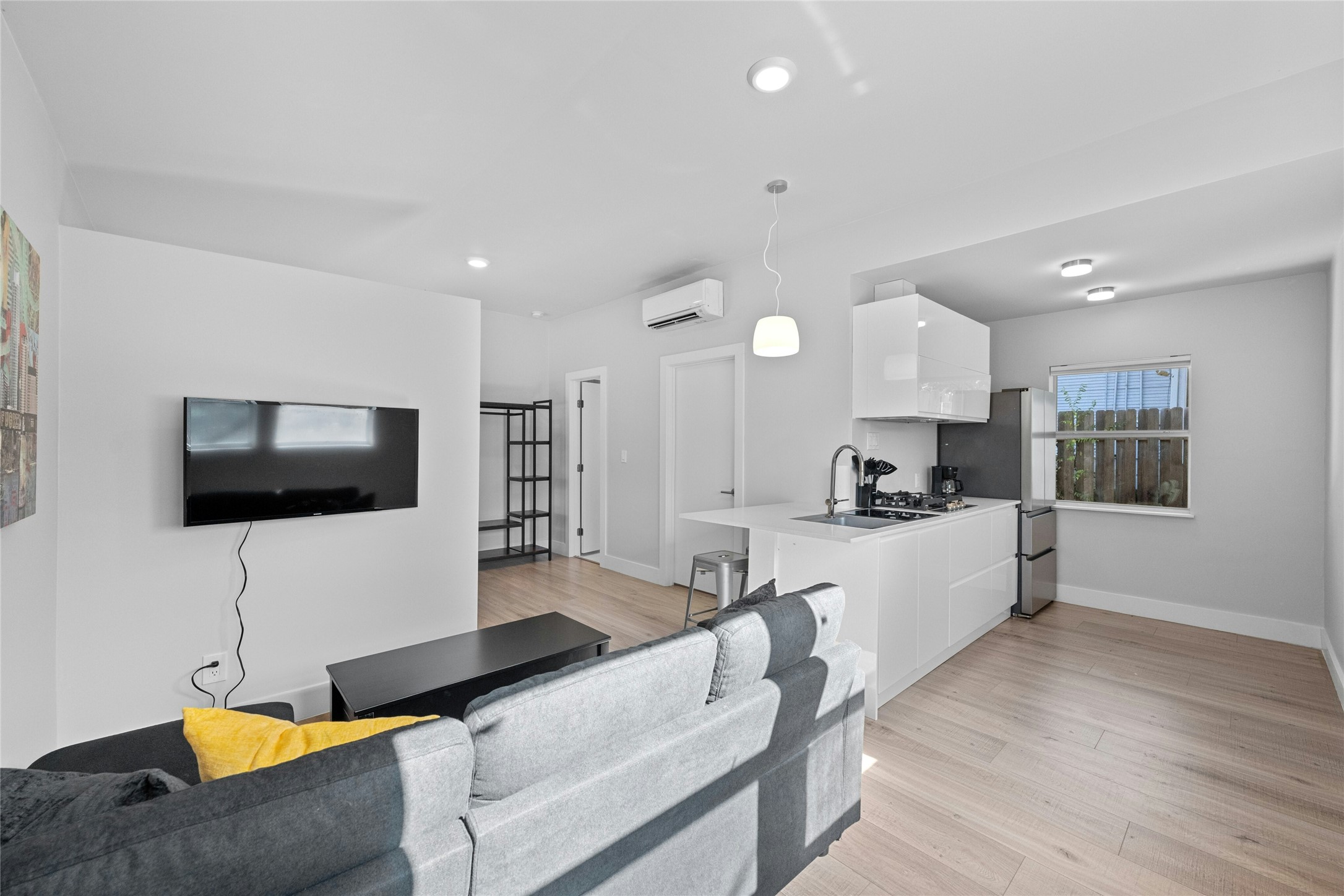 2201 Leon Street, Unit D Austin, TX 78705 - Photo 1 of 24 a living room with furniture and a flat screen tv
