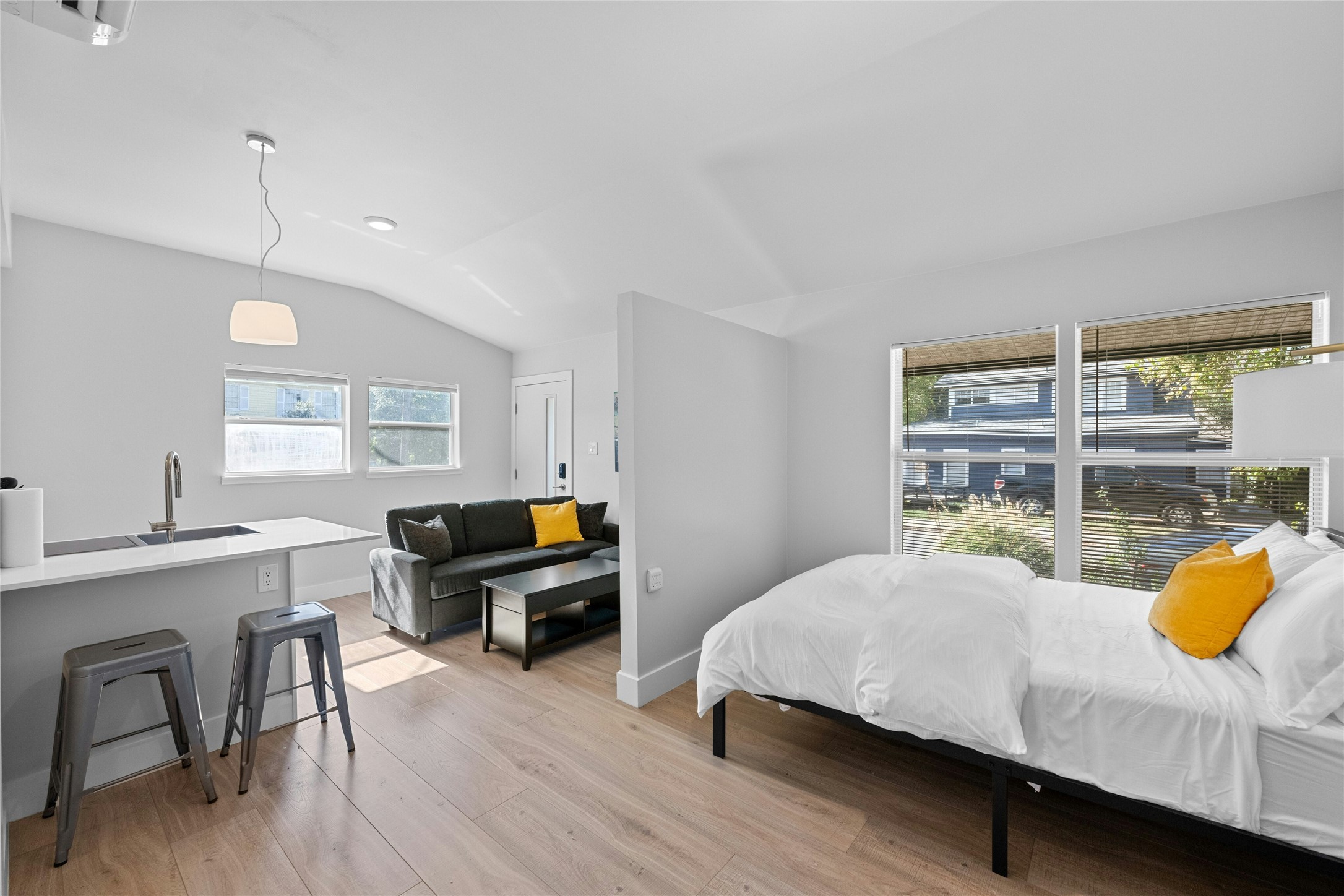 2201 Leon Street, Unit D Austin, TX 78705 - Photo 17 of 24 a bedroom with furniture and a wooden floor