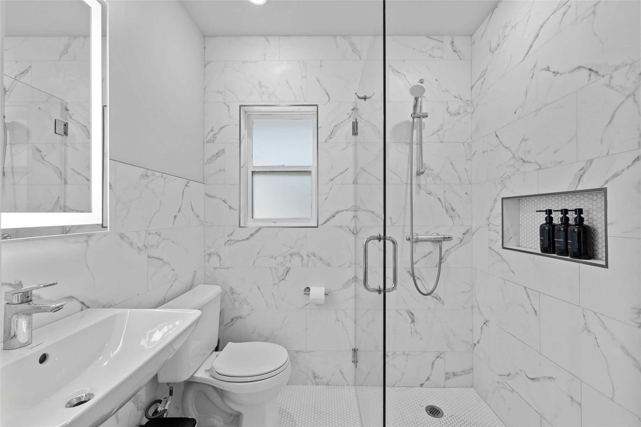 2201 Leon Street, Unit D Austin, TX 78705 - Photo 18 of 24 a bathroom with a toilet sink and shower