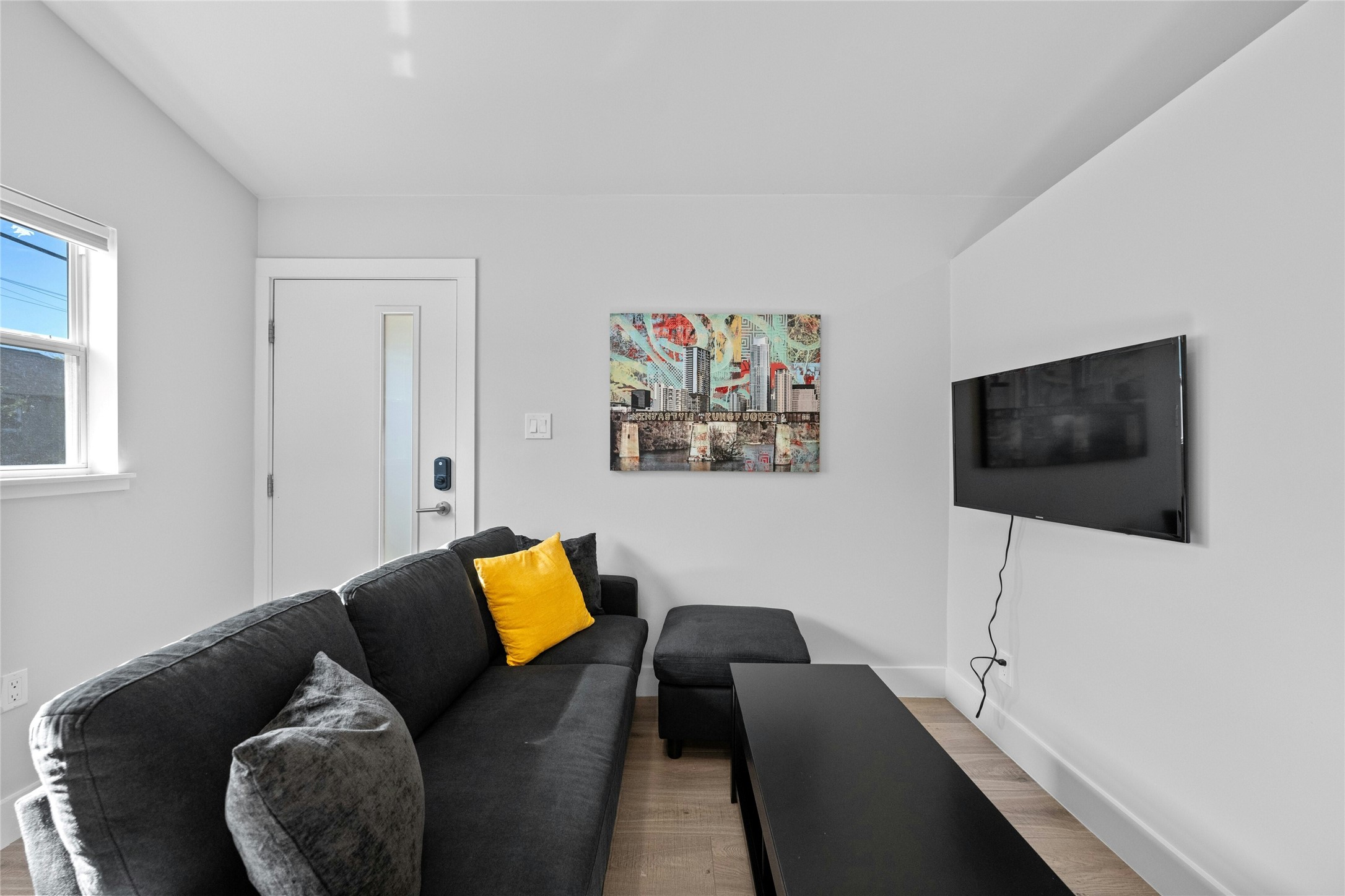 2201 Leon Street, Unit D Austin, TX 78705 - Photo 7 of 24 a living room with furniture and a flat screen tv