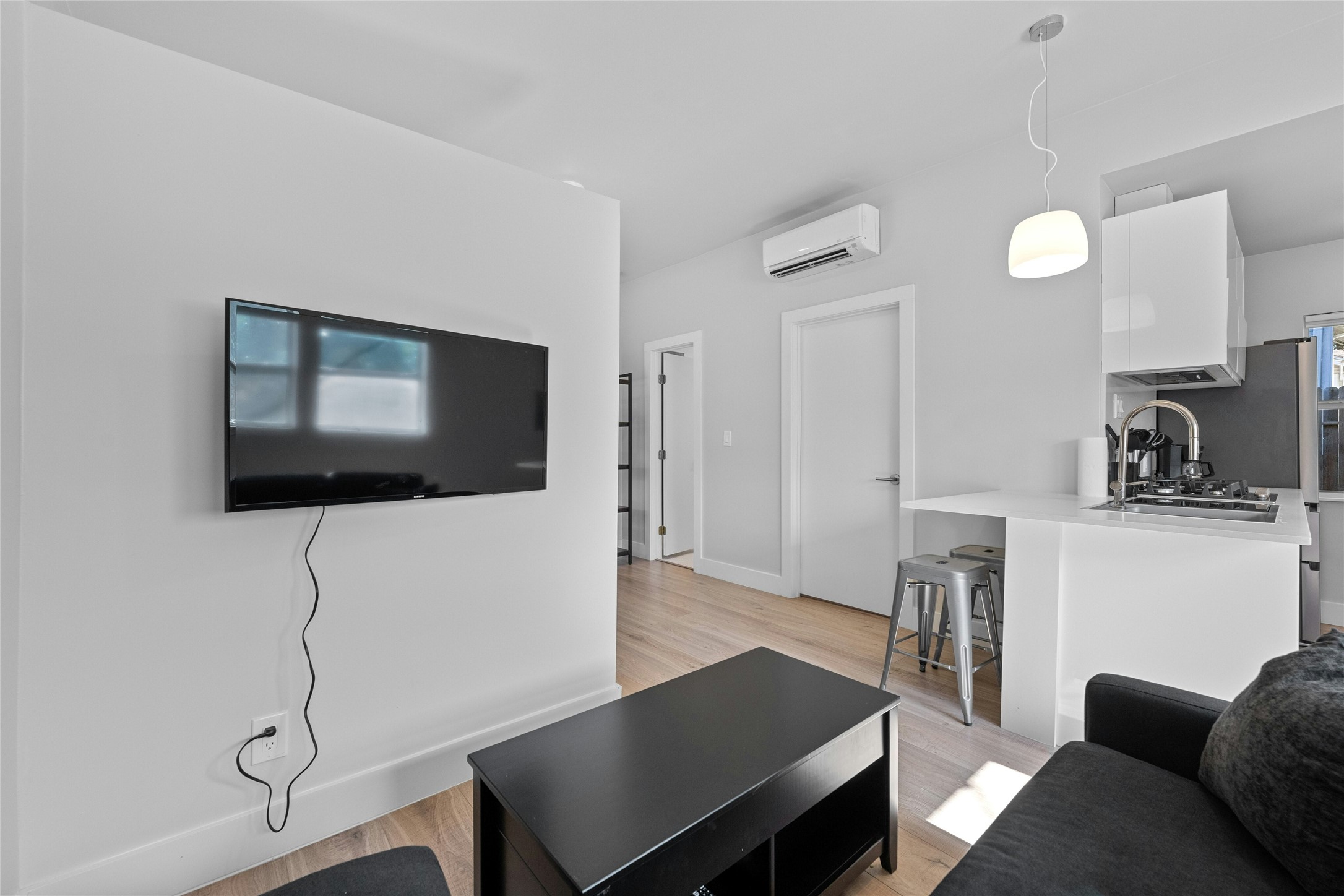 2201 Leon Street, Unit D Austin, TX 78705 - Photo 9 of 24 a living room with furniture and a flat screen tv