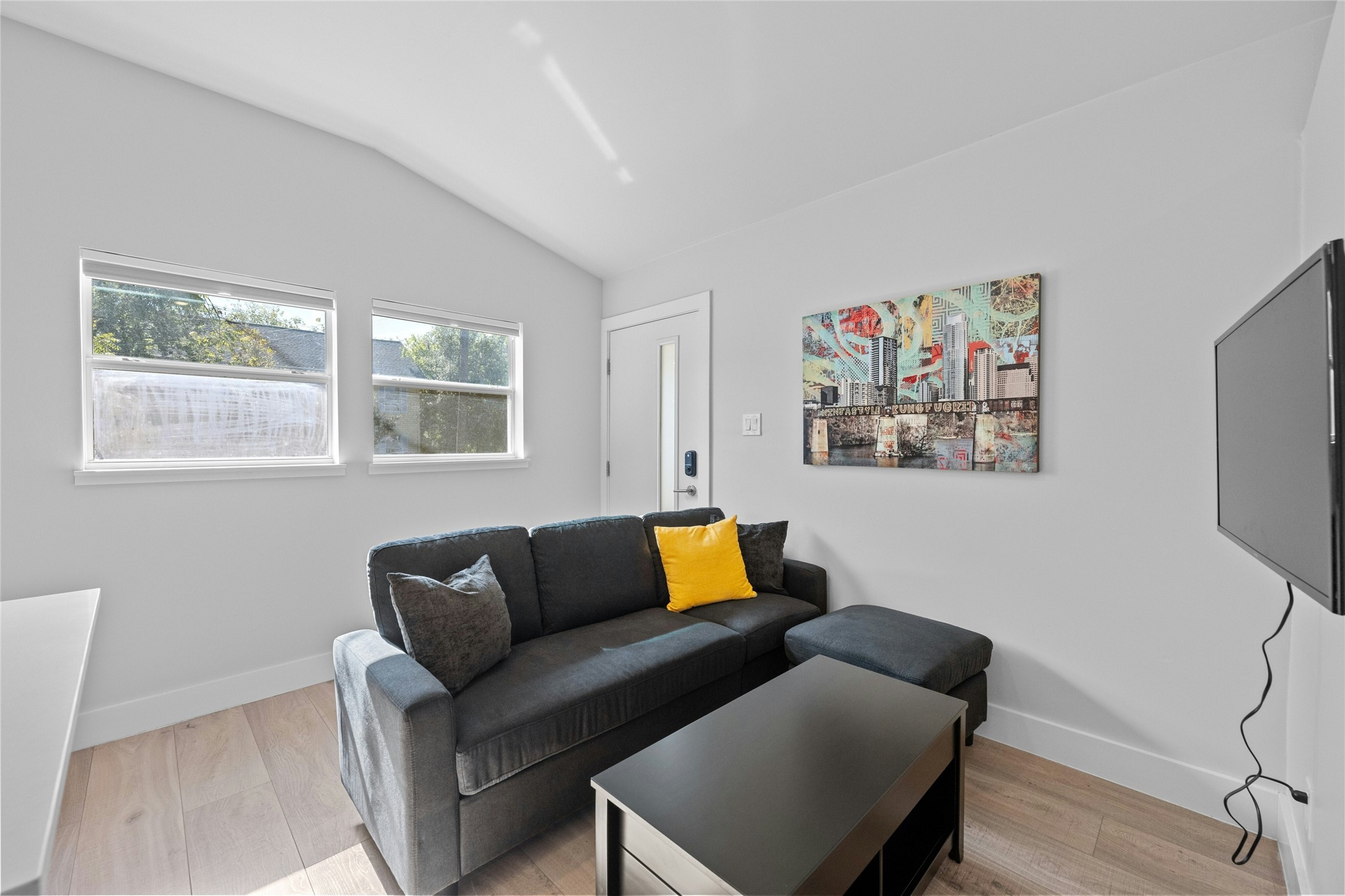 2201 Leon Street, Unit D Austin, TX 78705 - Photo 10 of 24 a living room with furniture a couch and a window
