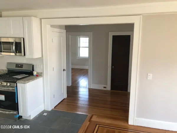 a view of a kitchen from the hallway