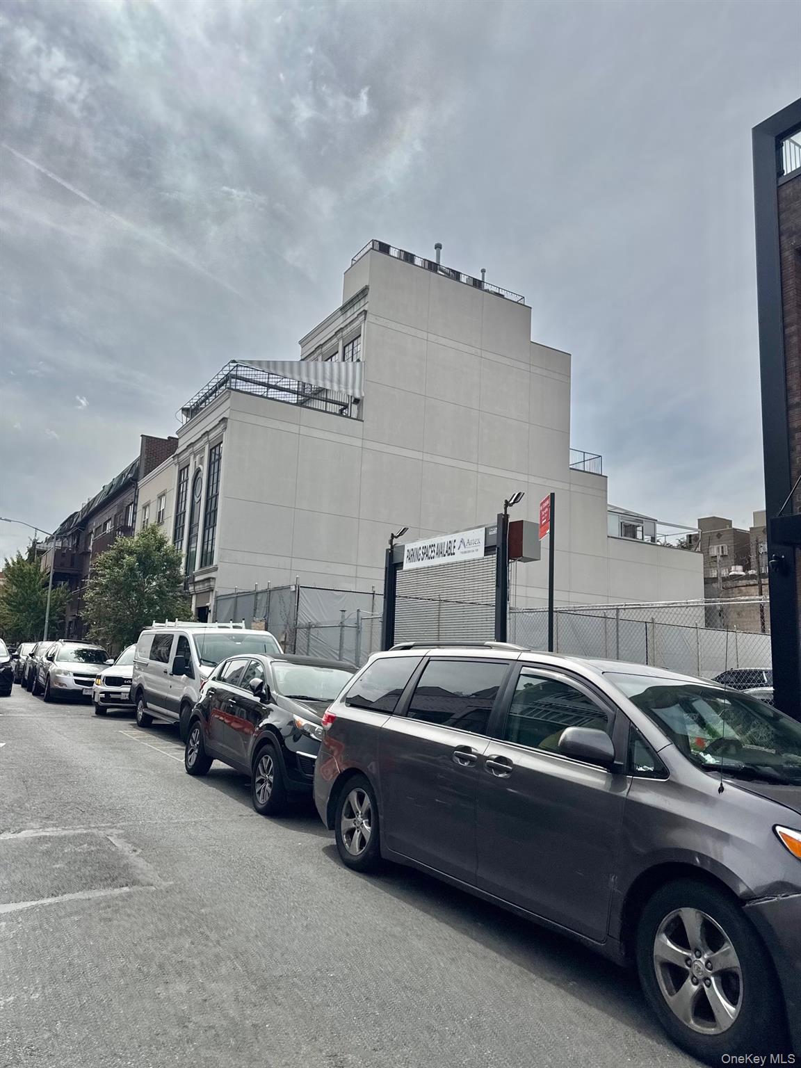102 Walworth Street Brooklyn, NY 11205 - Photo 13 of 13 a view of cars parked in front of a house