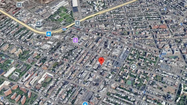 a view of cars parked in front of a house