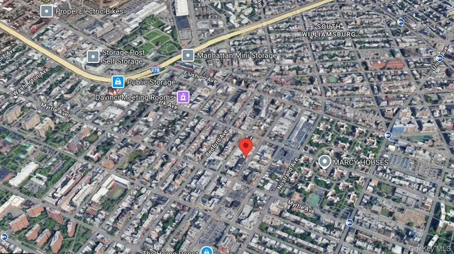 a view of cars parked in front of a house