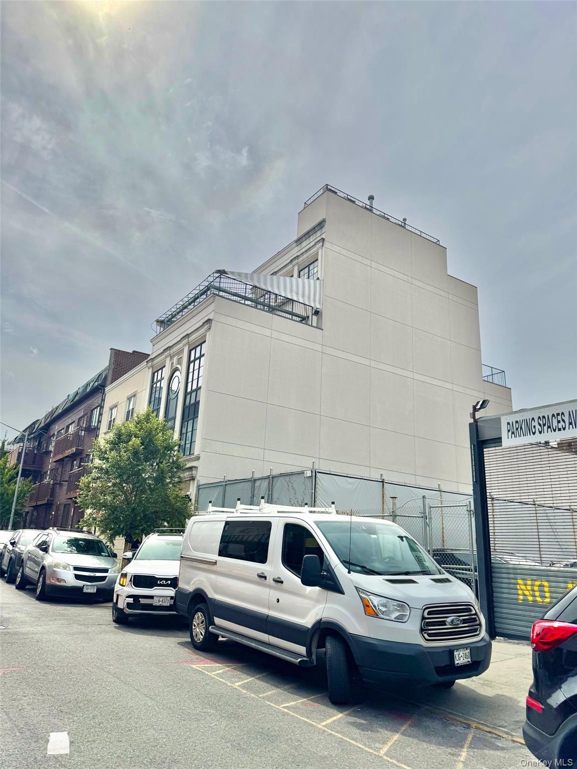 102 Walworth Street Brooklyn, NY 11205 - Photo 4 of 13 a view of cars parked in front of a house