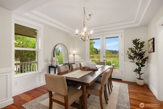 a view of a dining room with furniture window and outside view