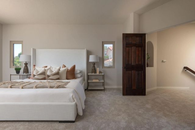 a large bed sitting in a bedroom and room