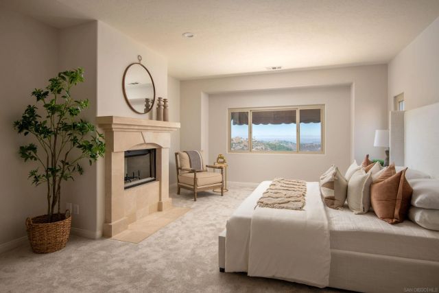 a bedroom with a bed and a fireplace