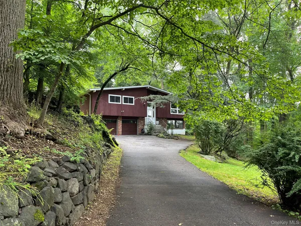 a kitchen with stainless steel appliances granite countertop a refrigerator a sink and a stove