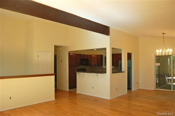 a view of a yard with wooden fence