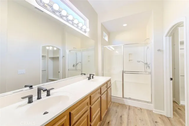 a bathroom with a sink double vanity and a mirror