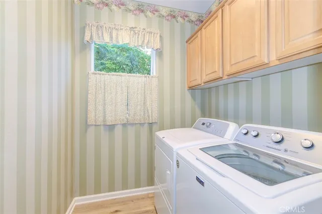 a view of a back yard with flower plants