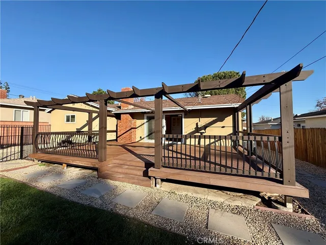 a view of a patio with glass top table and chairs