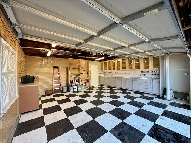 a room with a black white checkered floor with a black white checkered floor