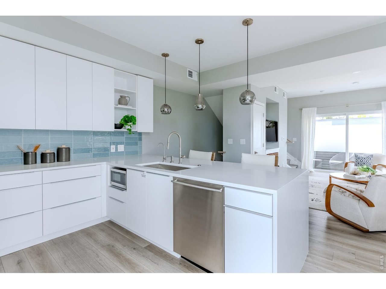 The open kitchen keeps the chef connected to the heart of the home, making it easy to cook, entertain, and be part of the conversation.
