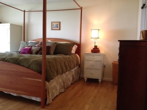 8 Charles Ridge Road, Unit C802 Littleton, MA 01460 - Photo 14 of 30 a bedroom with a bed and a night stand