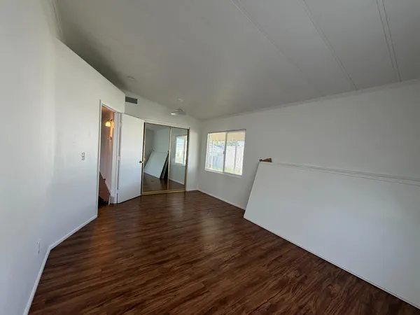 a view of balcony and wooden floor
