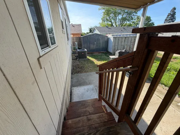 a view of a street with cars on the road