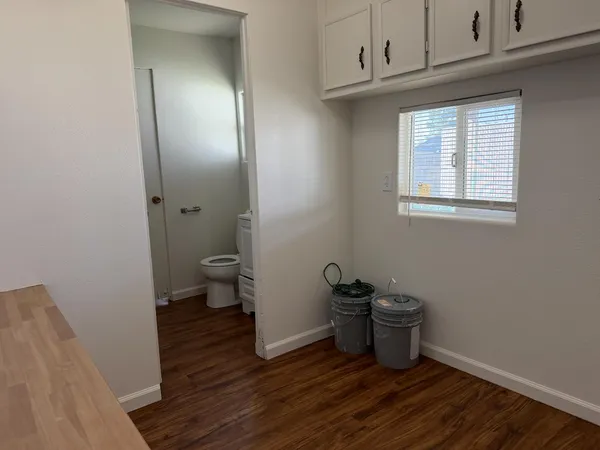 a bathroom with a sink toilet and vanity
