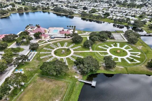 an aerial view of a house with a lake view