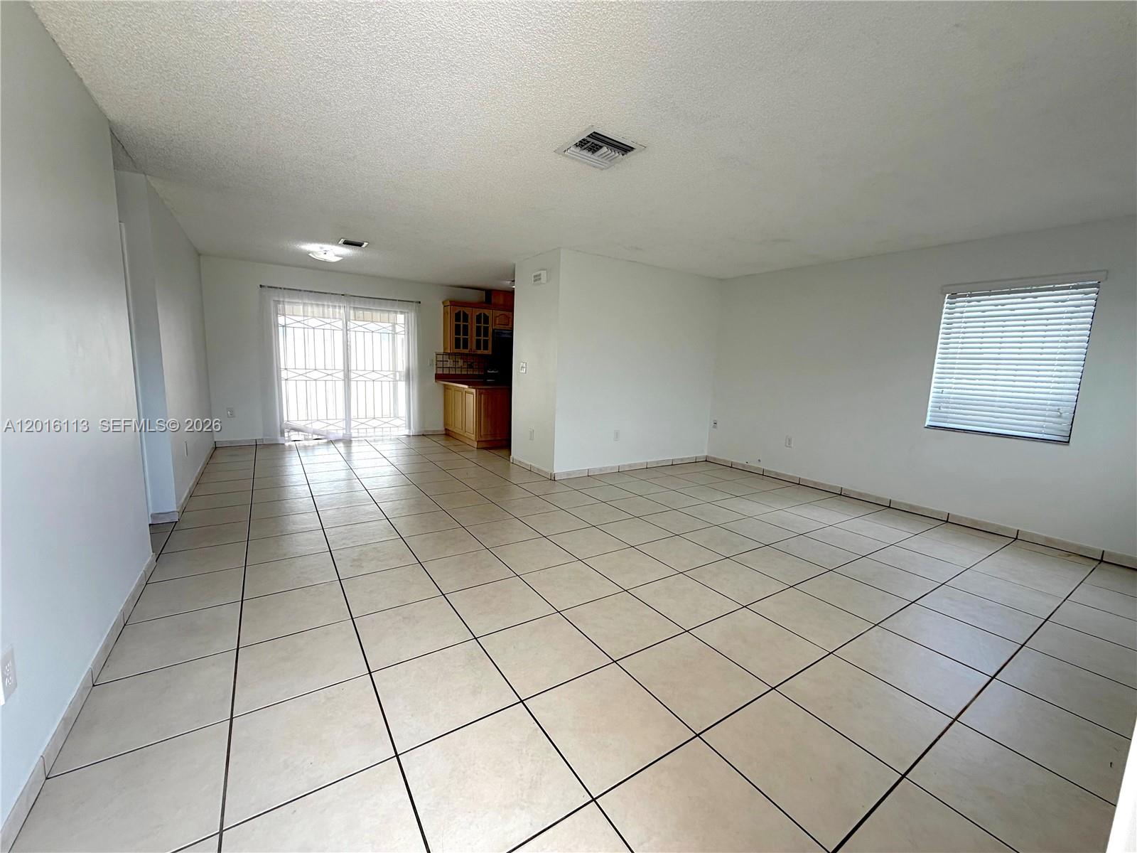 7993 Southwest 9th Terrace Miami, FL 33144 - Photo 2 of 18 a view of an empty room and window