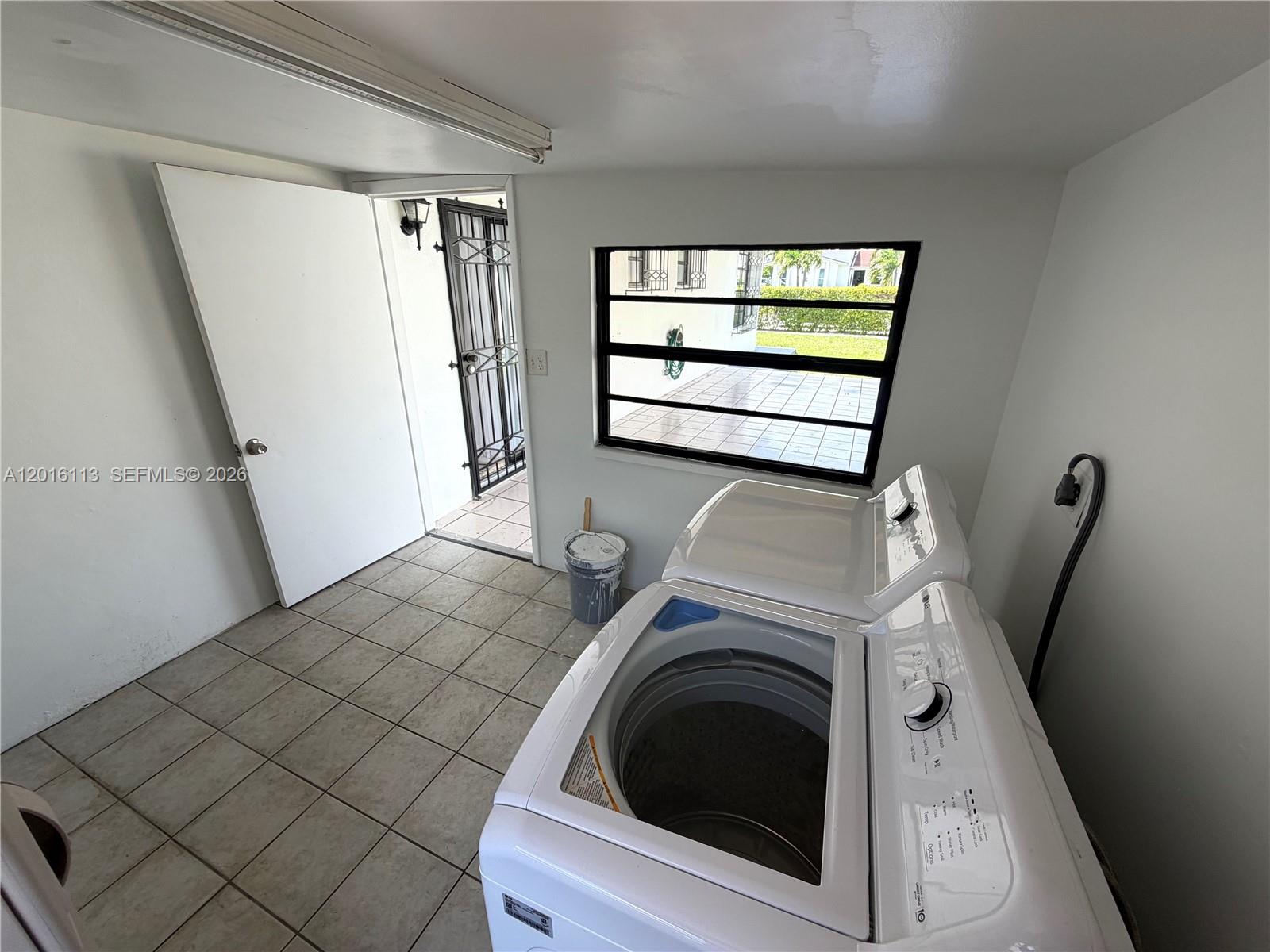 7993 Southwest 9th Terrace Miami, FL 33144 - Photo 5 of 18 a view of a storage & utility room with windows