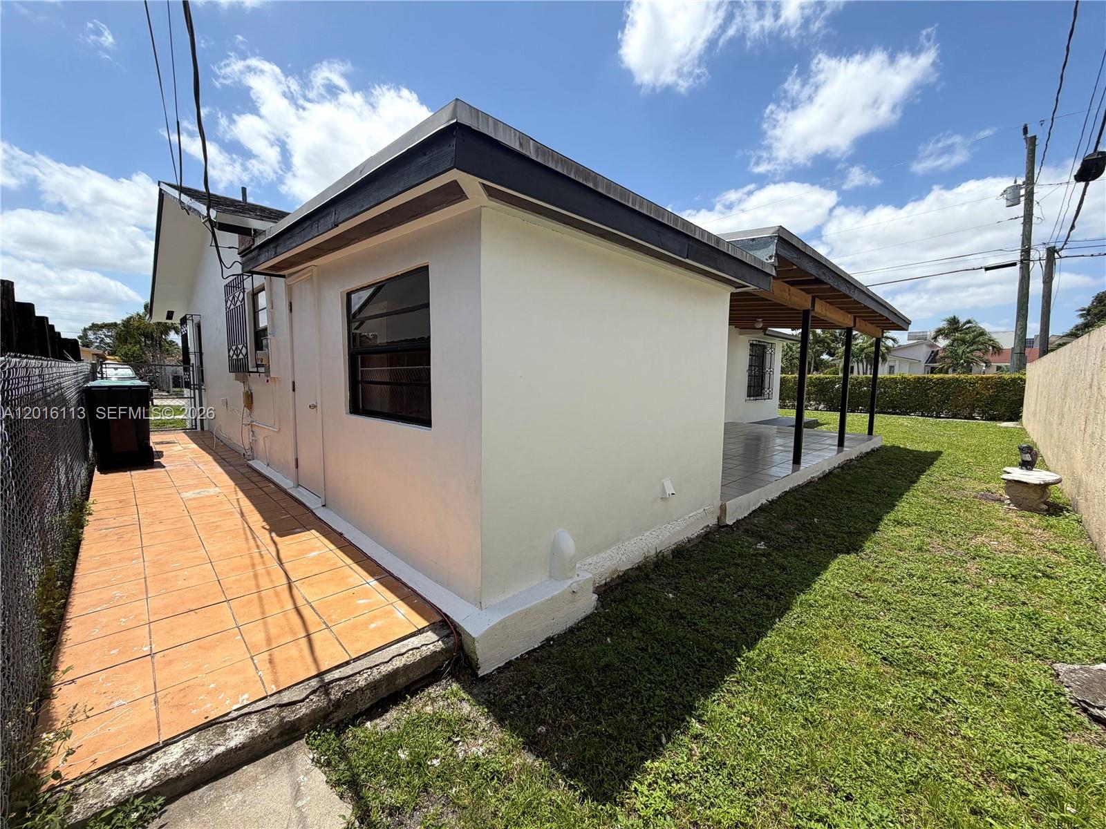 7993 Southwest 9th Terrace Miami, FL 33144 - Photo 6 of 18 a view of a house with a yard