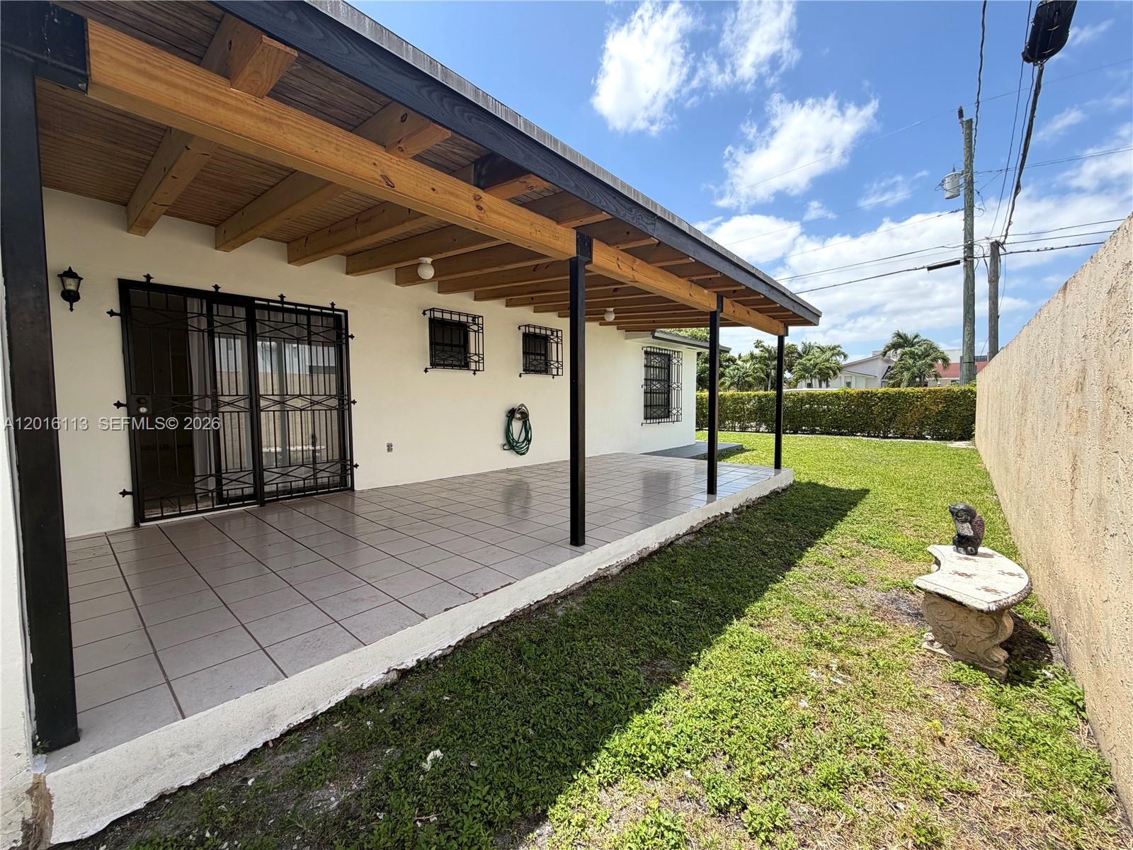 7993 Southwest 9th Terrace Miami, FL 33144 - Photo 7 of 18 a view of a porch with garden