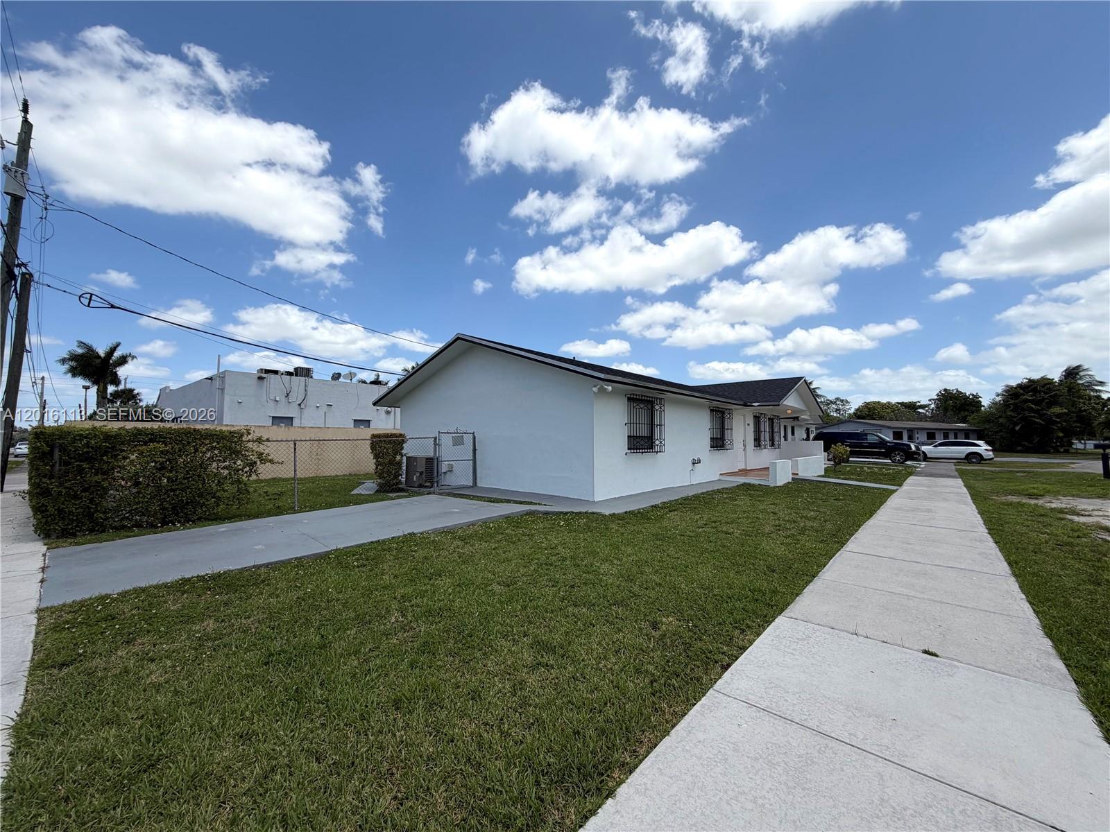 7993 Southwest 9th Terrace Miami, FL 33144 - Photo 10 of 18 a front view of a house with garden