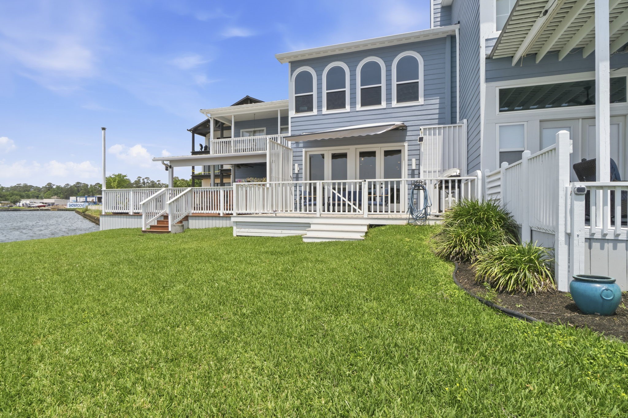 2 Key Harbour Conroe, TX 77356 - Photo 23 of 41 a front view of a house with a yard table and chairs