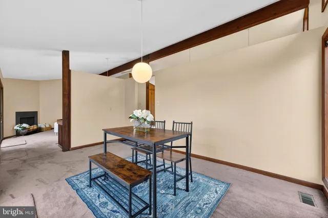 a kitchen with kitchen island granite countertop a sink counter top space and stainless steel appliances