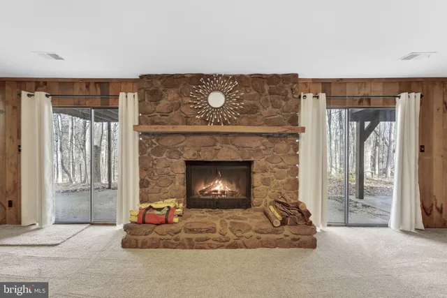 a view of room with furniture and windows