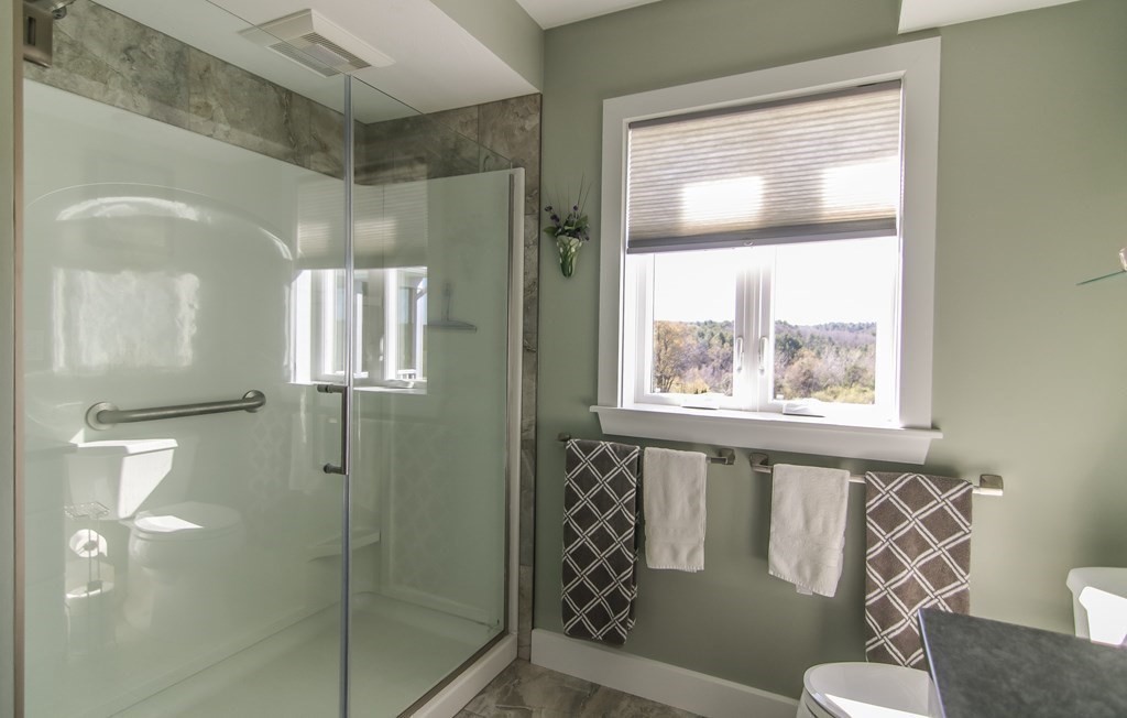 75 Happy Hollow Road Oakham, MA 01068 - Photo 20 of 40 a bathroom with a window and a shower
