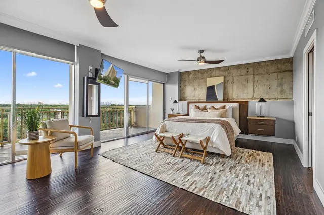 a bedroom with furniture and wooden floor