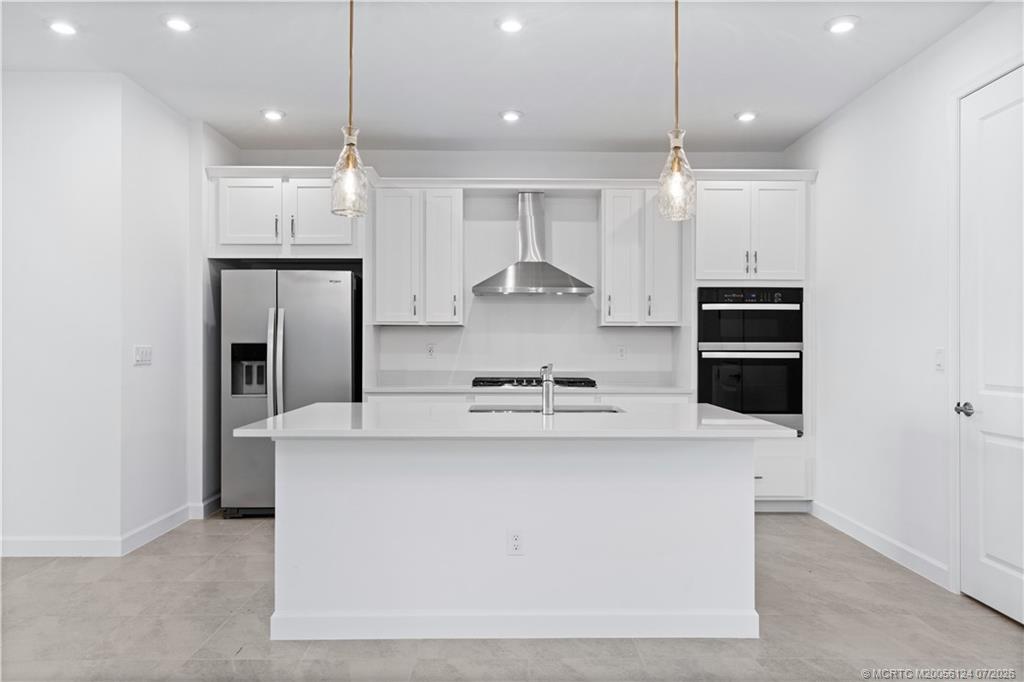 9731 Southwest Indra Way Port St. Lucie, FL 34987 - Photo 7 of 33 Kitchen and Large Island